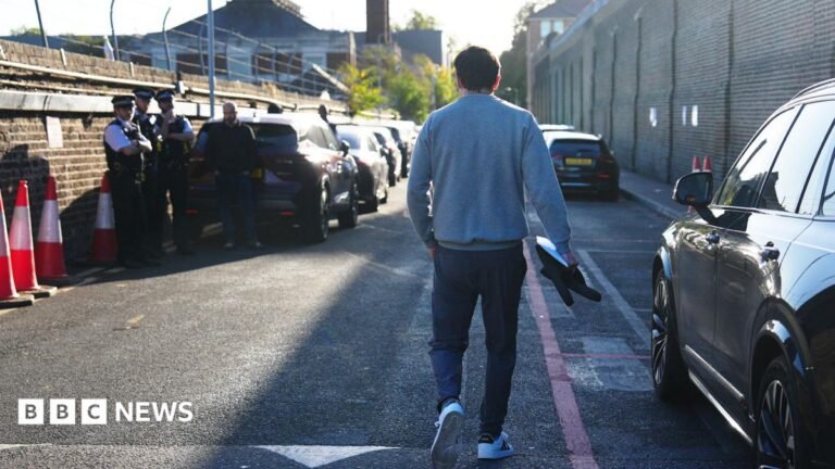 Hundreds of criminals leave prison under early release scheme A man walks down the driveway of Brixton prison in south London.