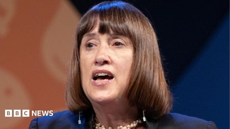 Jane Dodds standing down as Welsh Liberal Democrats leader An man is wearing a green helmet with chin straps. He is wearing camouflage clothing and looking up into the distance. He is surrounded by trees.