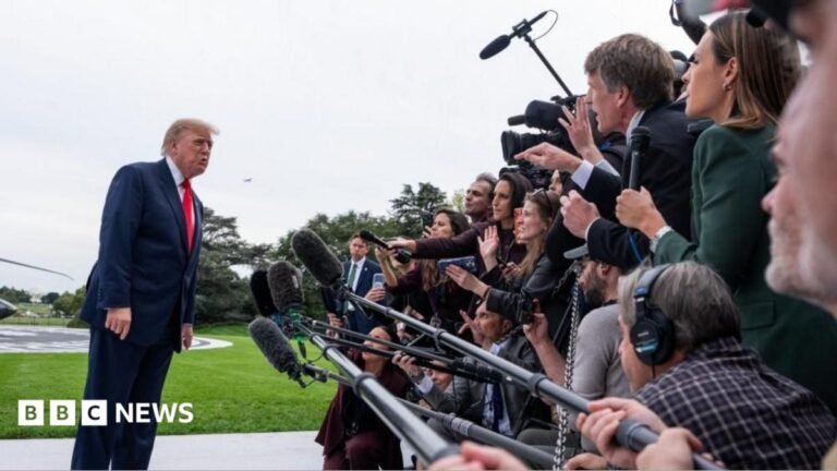Justice Department investigating television networks over Trump pool coverage Donald Trump speaks to a large media scrum