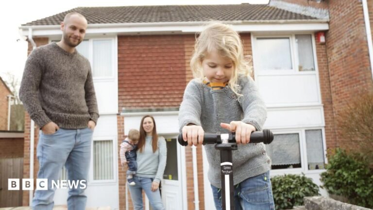‘Painful’ years ahead, think tanks warn, as living standards set to fall Family outside a house including a man, woman with a small child on her hip and another small child riding a scooter in the foreground