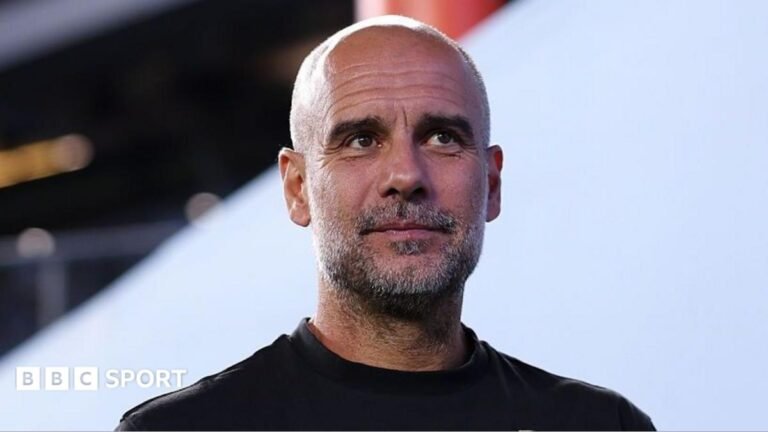 Former Manchester City manager Pep Guardiola wearing a black top
