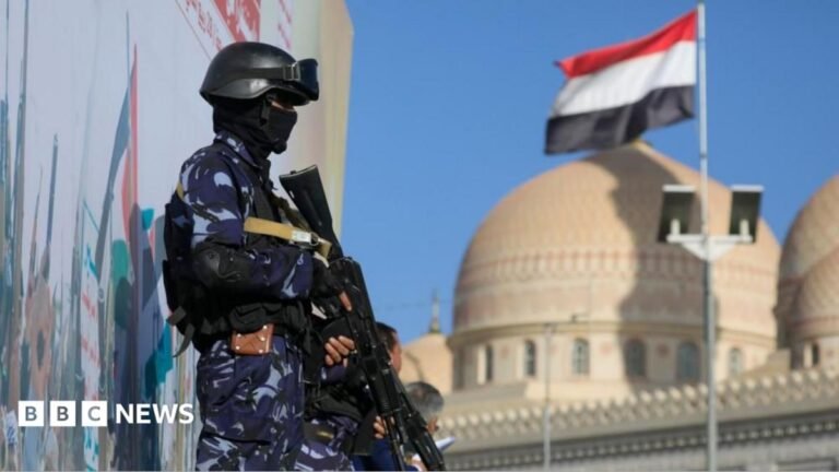 Houthi soldiers in blue camouflage uniform stand guard with weapons during a protest against Saudi Arabia, in Sana'a, Yemen, 9 October 2026