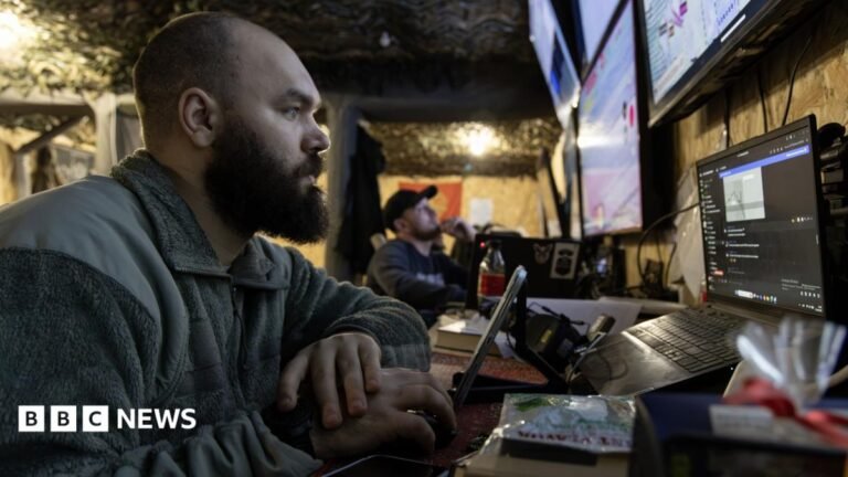 Ukraine says Starlink connection ‘now stable’ after network limits A close up of a Ukranian soldier surrounded by computer screens